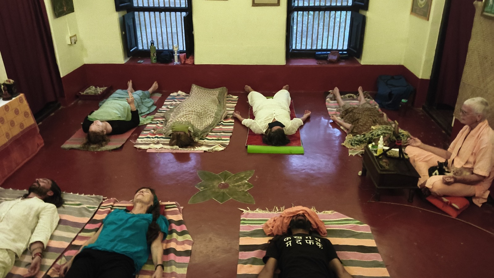 An Advanced Yoga Nidra session, Swamiji guiding from the corner of the hall