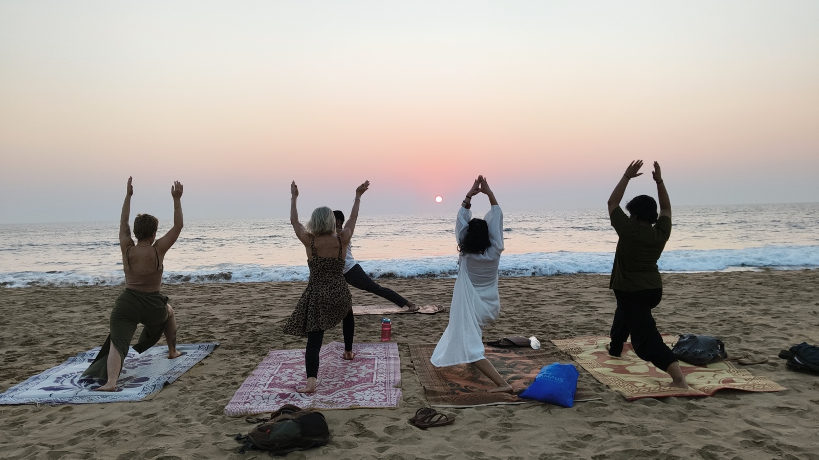 Sunrise asana on the beach