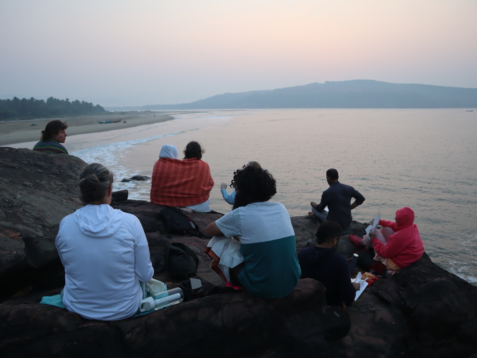 Sunset meditation on the rocks above the beach