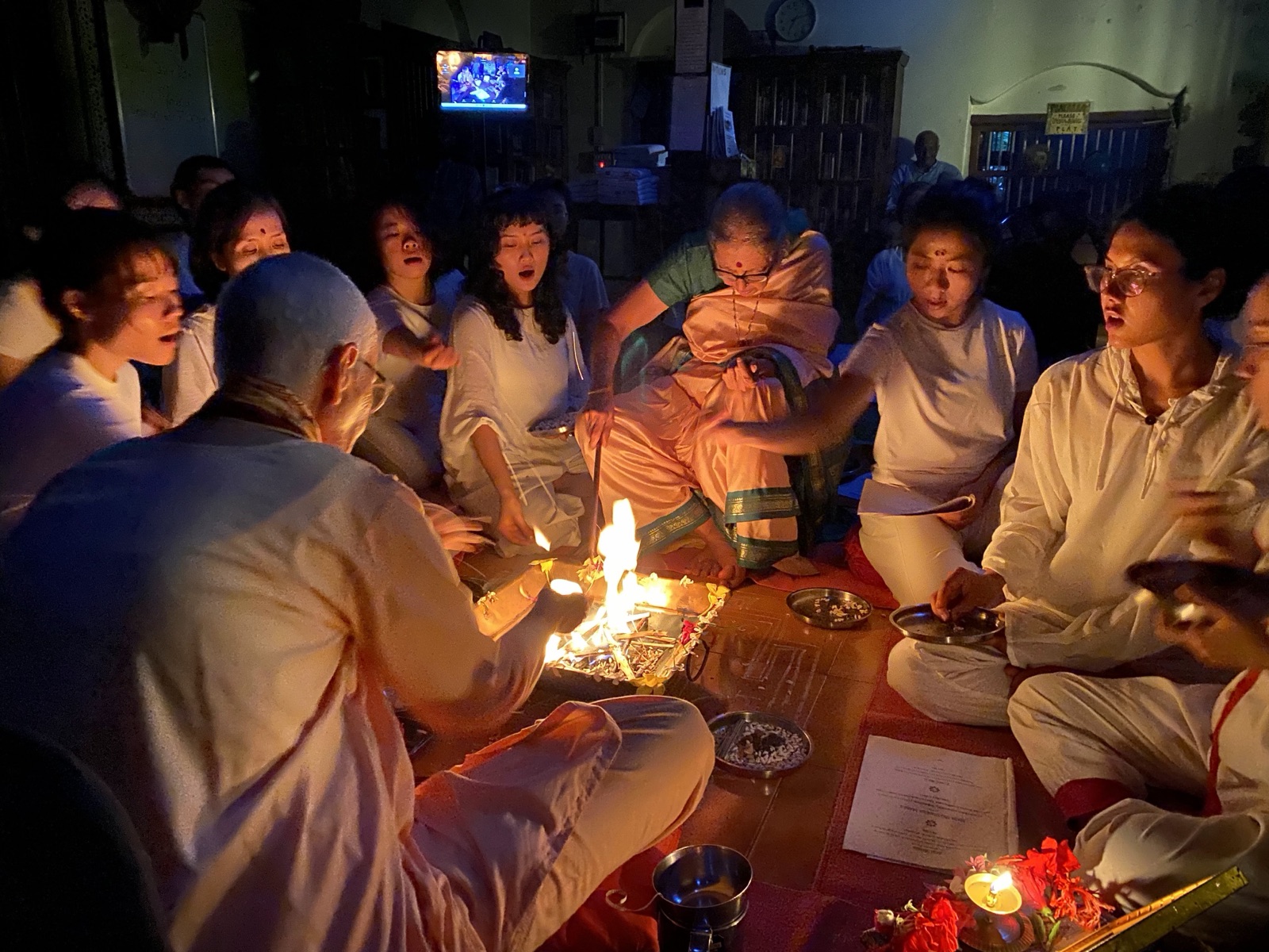 Chanting together around the evening fire