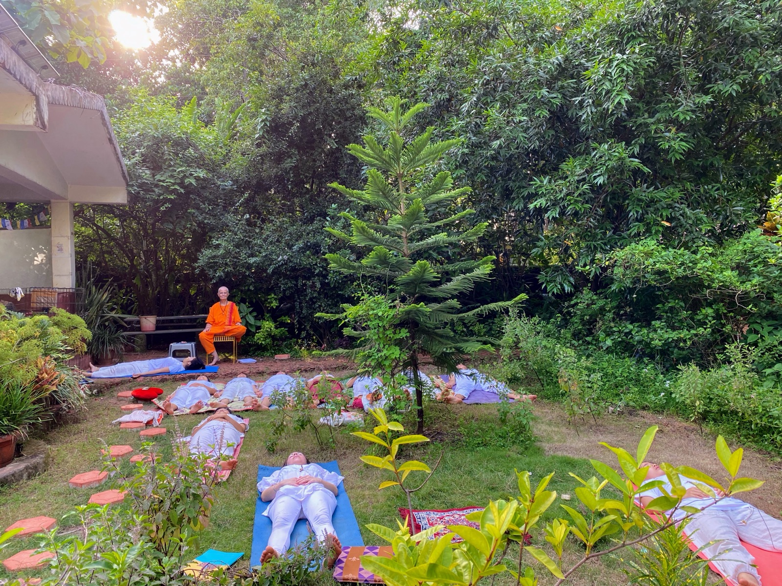 Yoga Nidra in the garden, Swamiji guiding